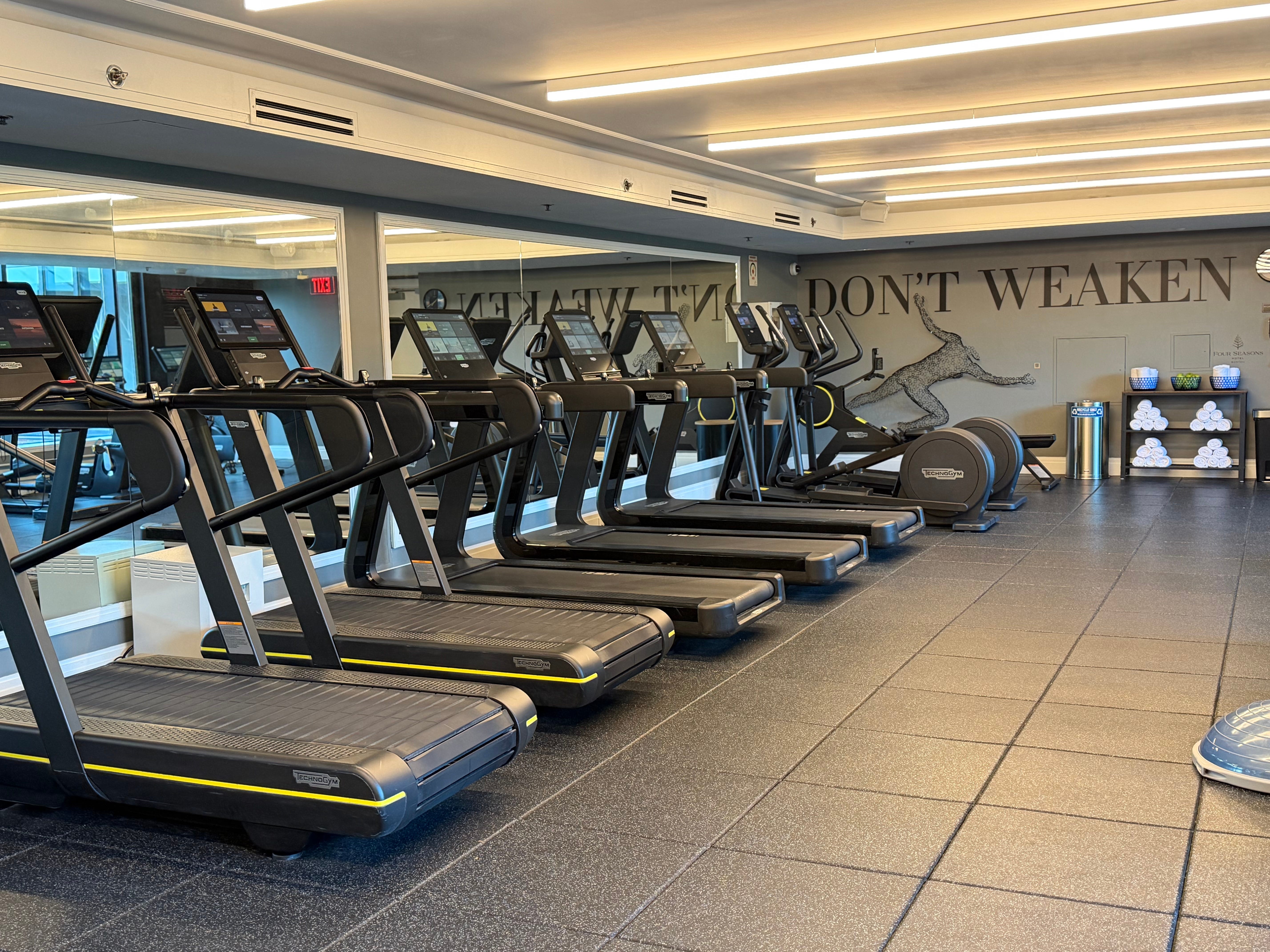 A row of treadmills in the gym at the Four Seasons.