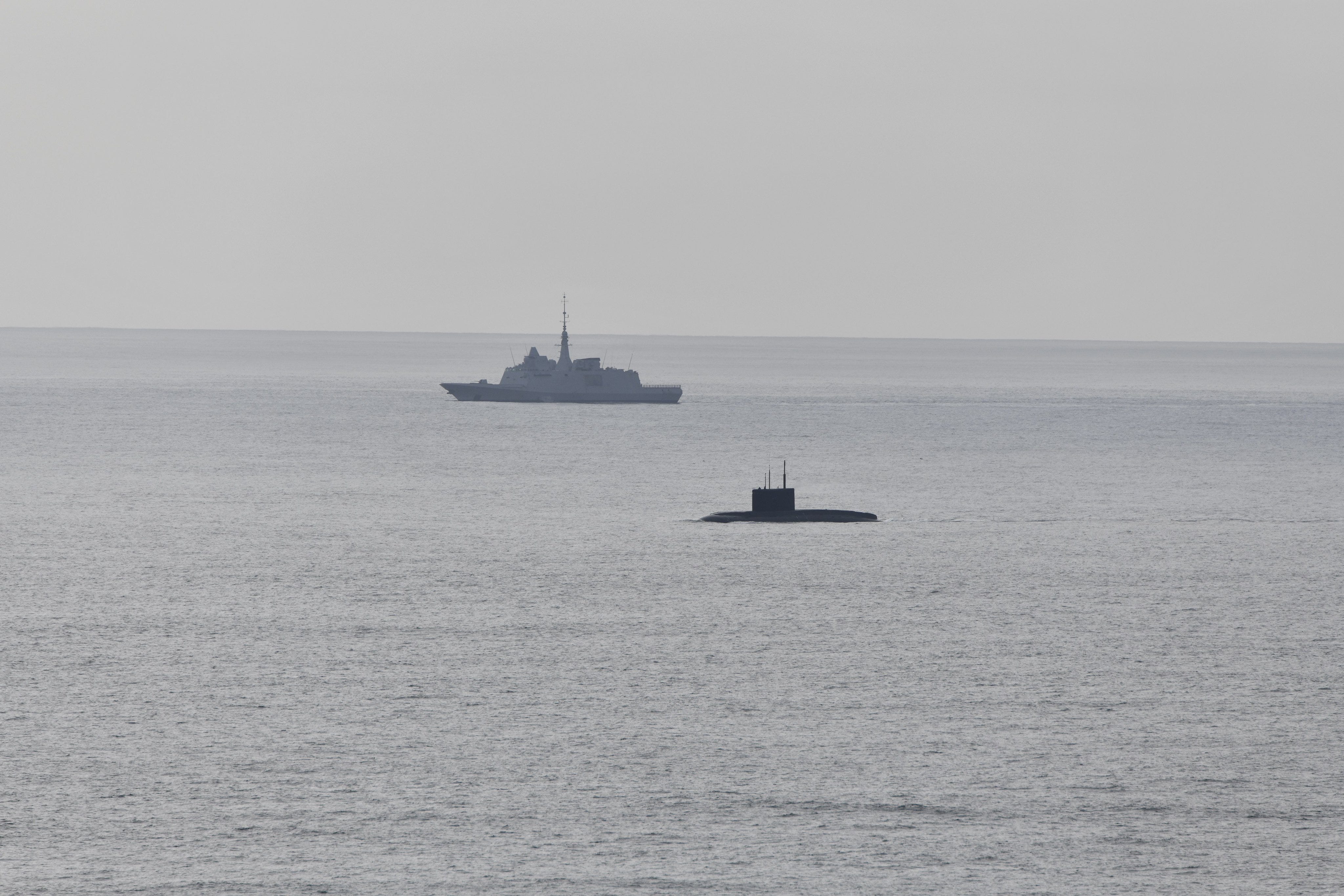 A French warship monitors a Russian submarine in October 2025.