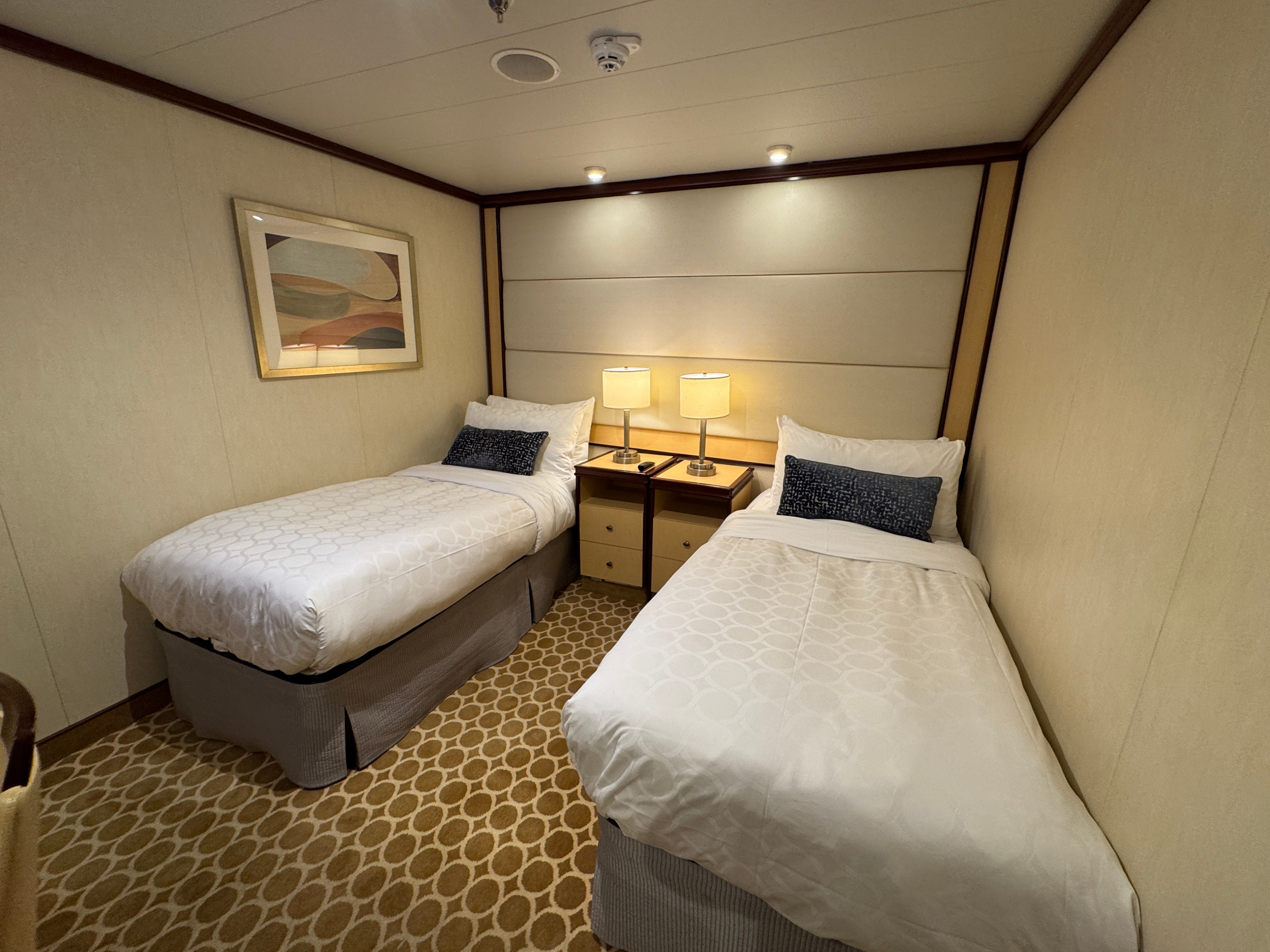 The author's interior cabin, with two beds and nightstands.