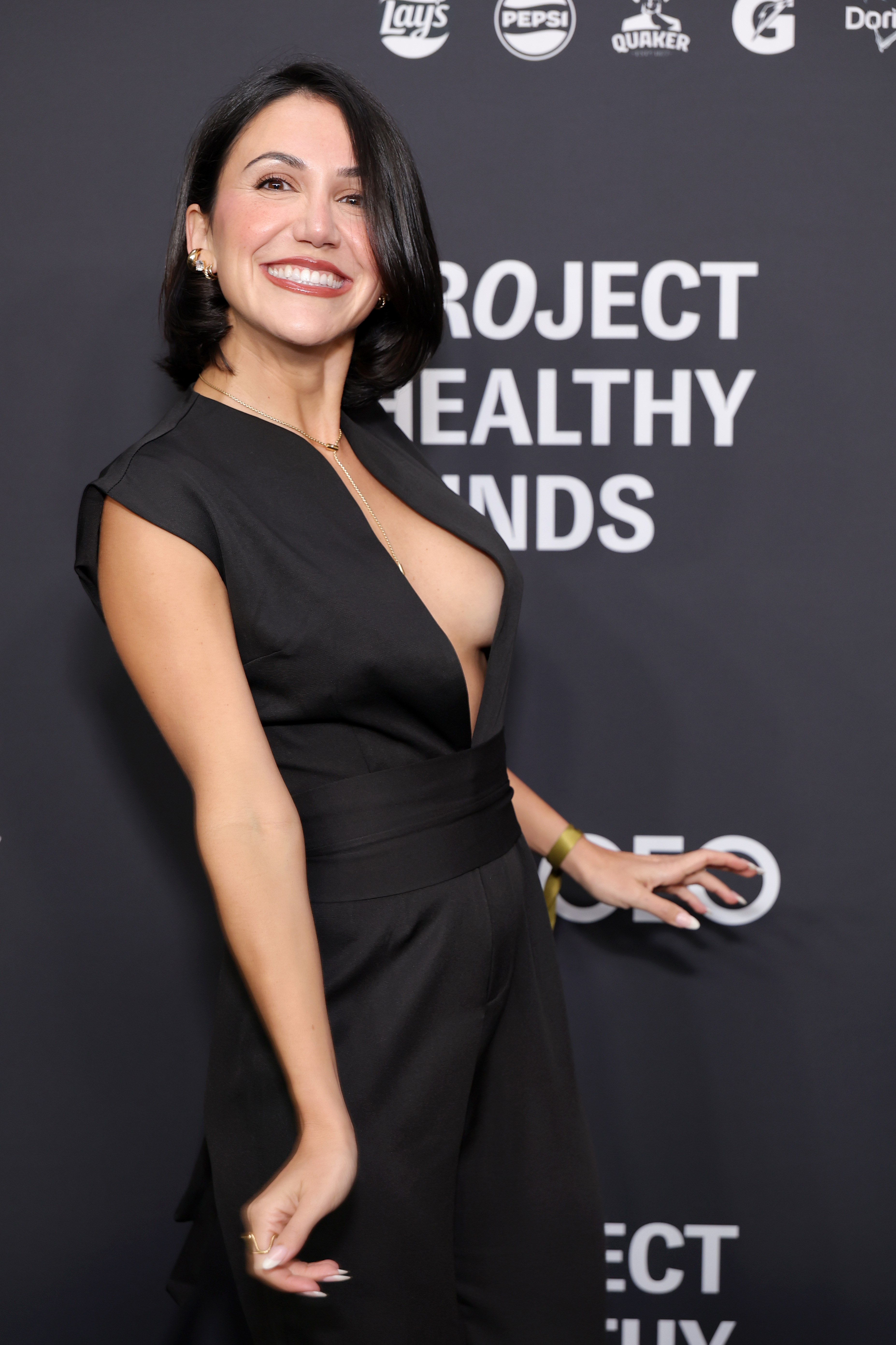 Kat Stickler in a black jumpsuit at the Project Healthy Minds 3rd Annual Gala.