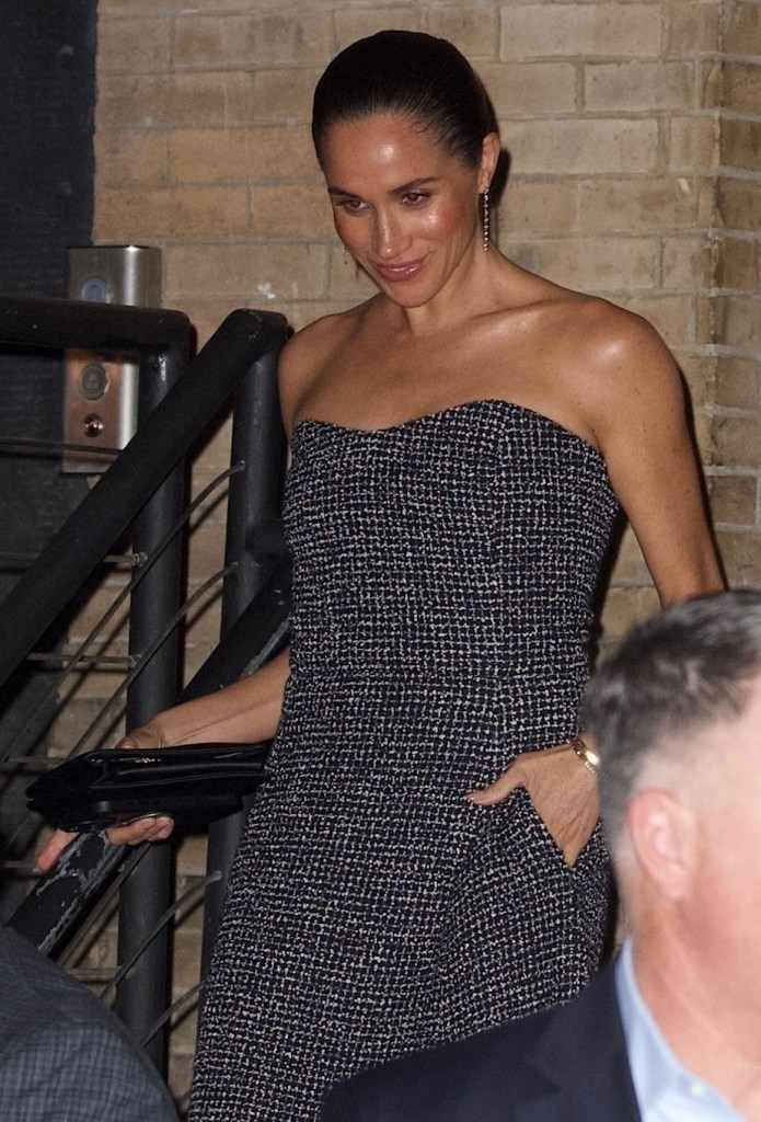 Meghan Markle in a black and white tweed strapless dress.
