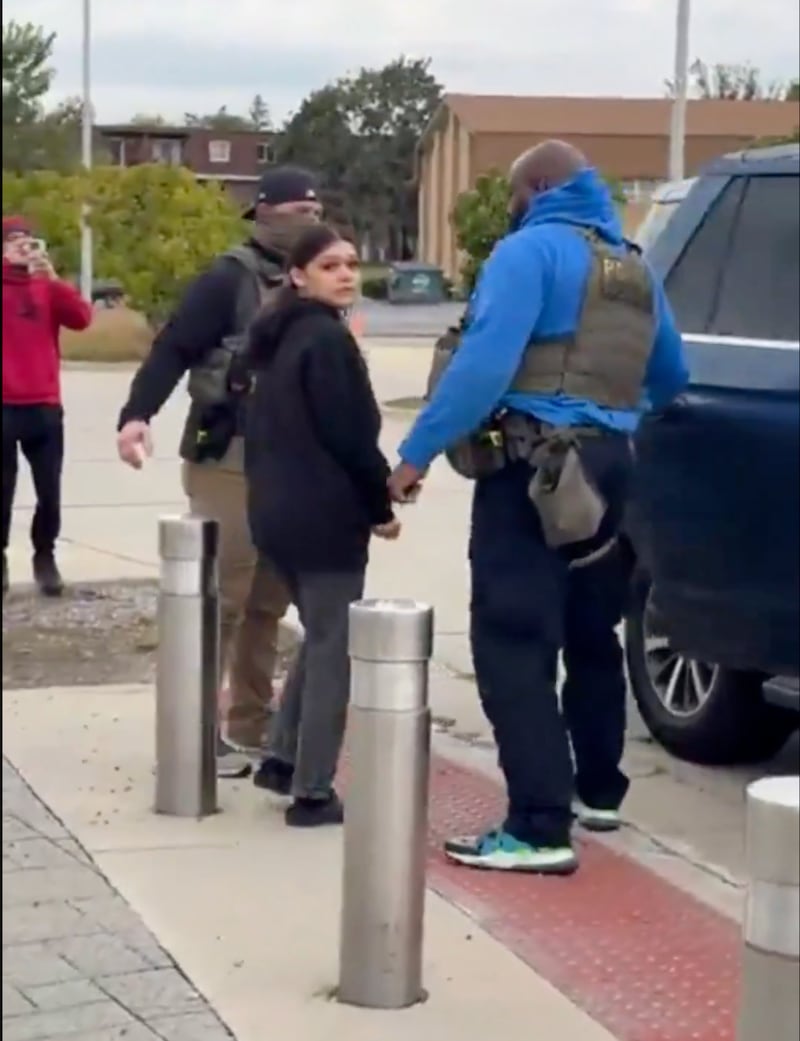 The clearly scared girl was filmed being placed back into the same Ford car by the ICE officers who had detained her.