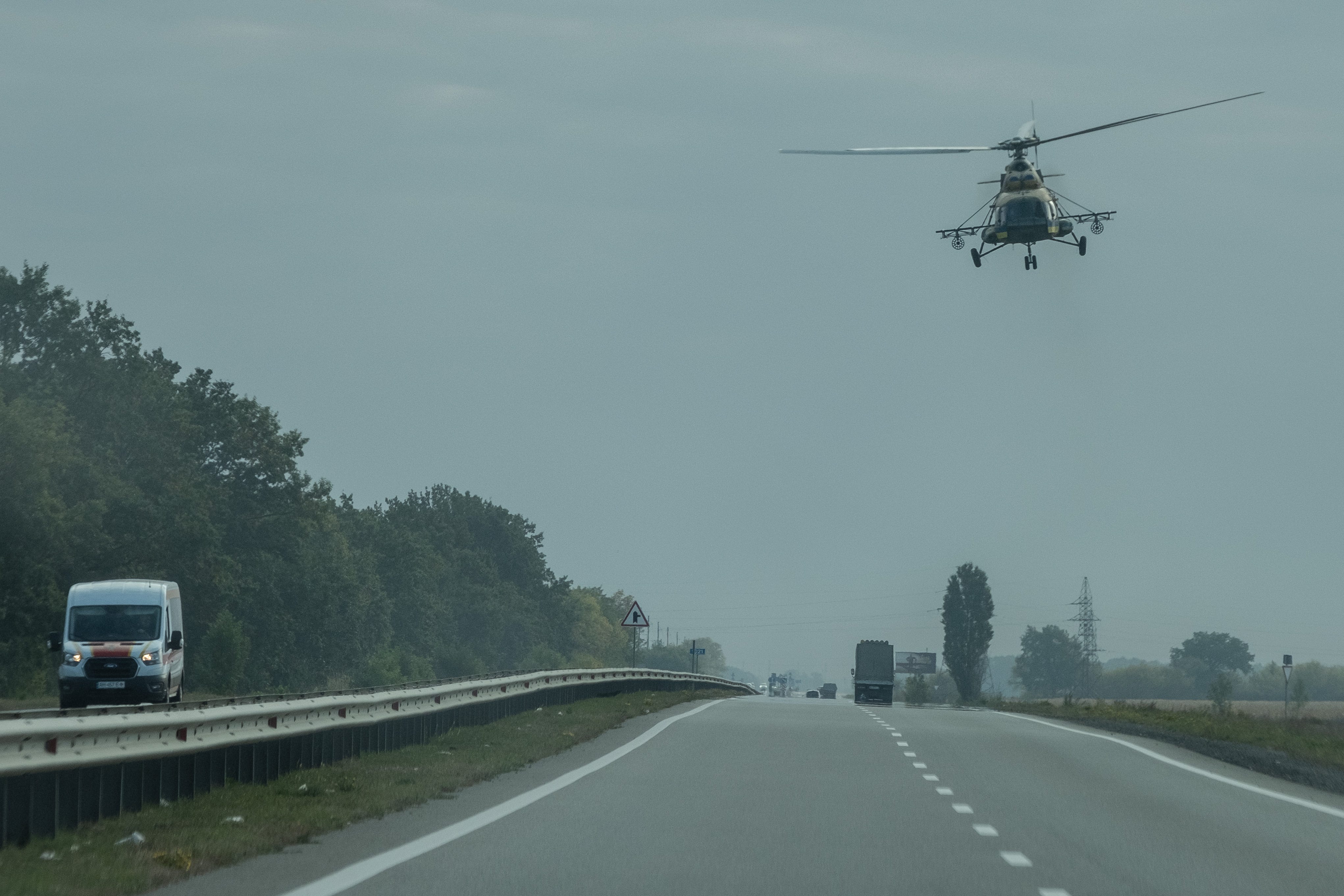 A low-flying Ukrainian military helicopter using the roads for navigation in the Dnipropetrovsk Oblast Region.
