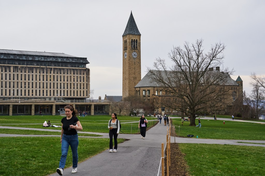 Students walk across the Arts Quad at Cornell University.
