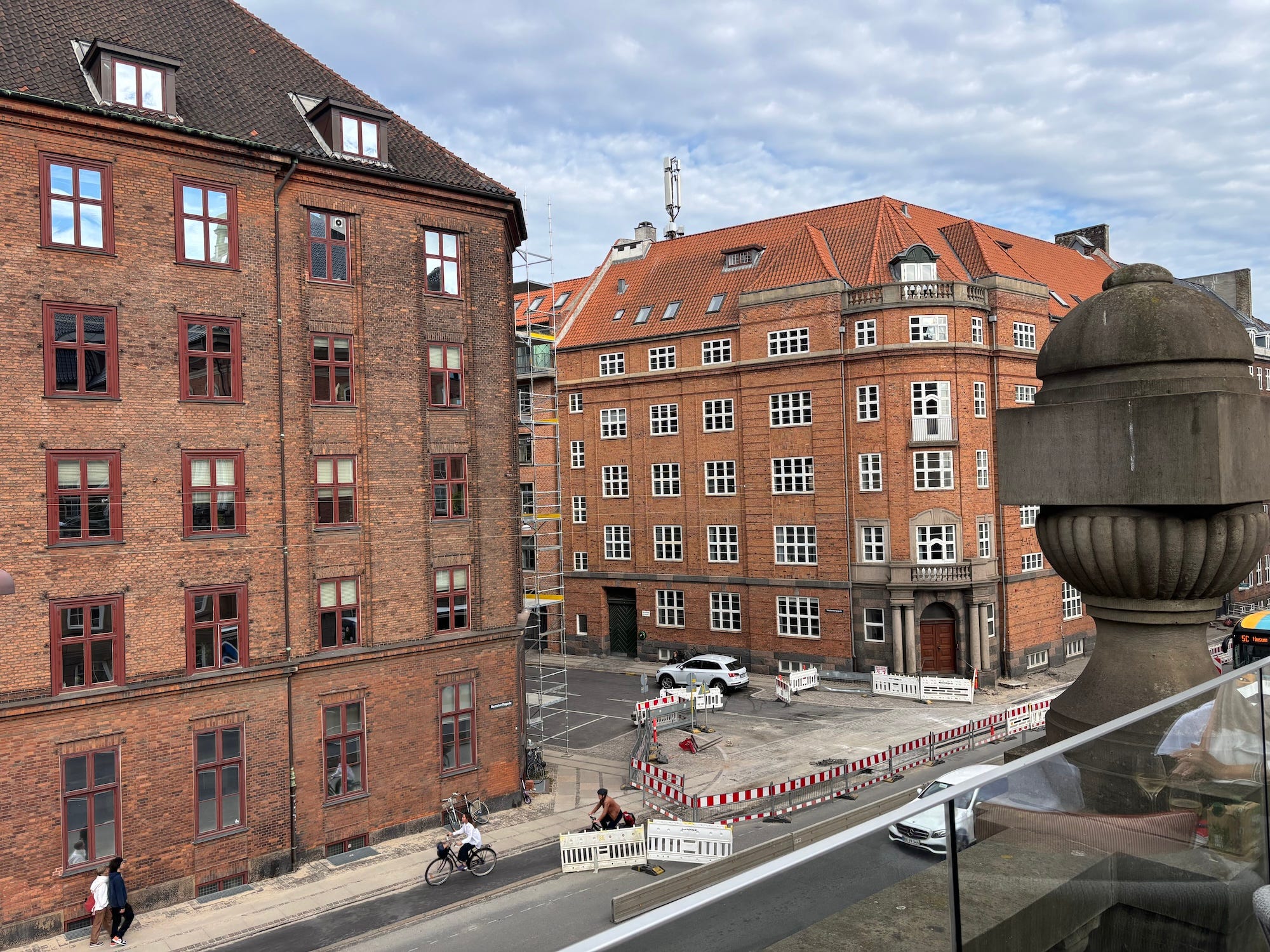 A shot of buildings in Copnehagen with a partly cloudy sky.