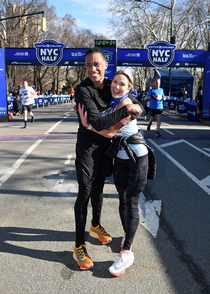 T.J. Holmes and Amy Robach hugging while running a marathon.