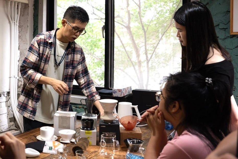 Nian Yang-yi volunteers at a community cafe where he also trains other aspiring baristas.