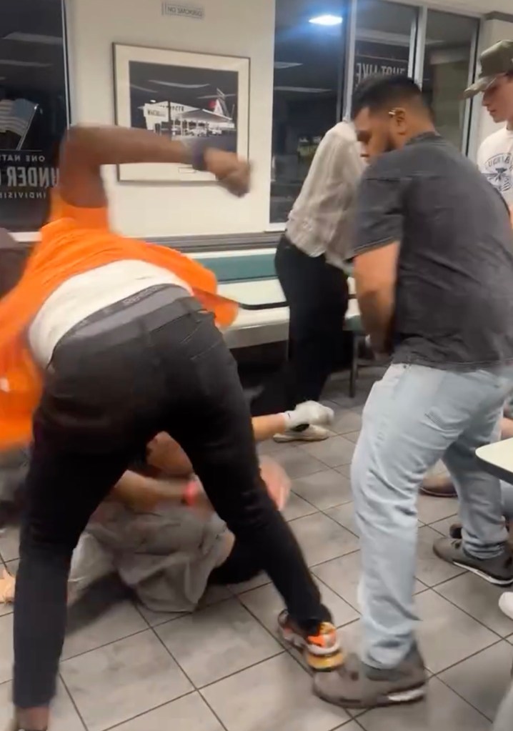 Multiple people brawling inside a San Antonio Whataburger.