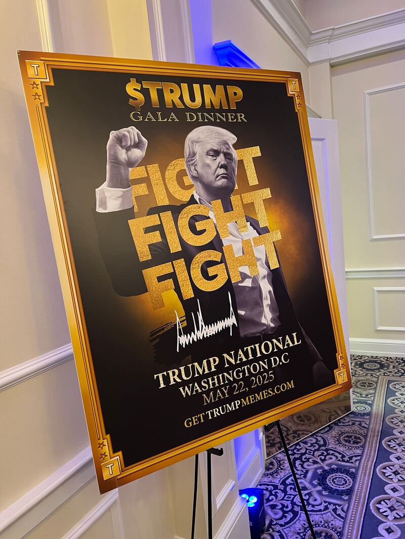 $TRUMP meme coin dinner signage of Donald Trump.