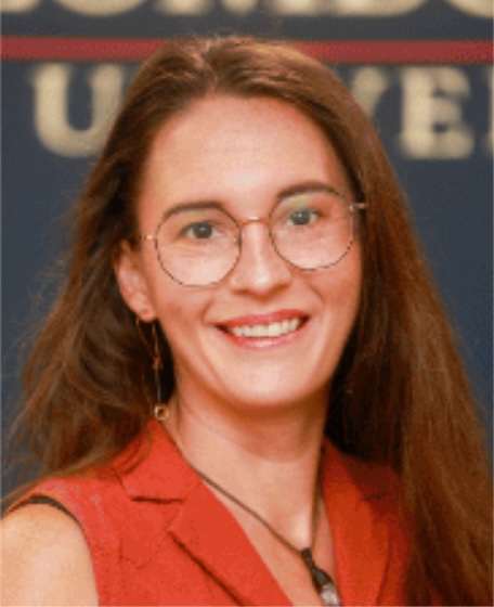 Headshot of a woman with long dark hair, glasses, and a red top smiling.