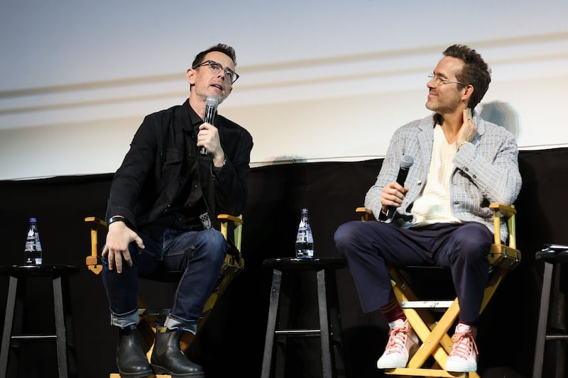 HOLLYWOOD, CALIFORNIA - OCTOBER 02: (L-R) Colin Hanks and Ryan Reynolds speak onstage during John Candy: I Like Me, an evening with Ryan Reynolds at The Montalban on October 02, 2025 in Hollywood, California. (Photo by Monica Schipper/Getty Images for Maximum Effort and Mills Entertainment)