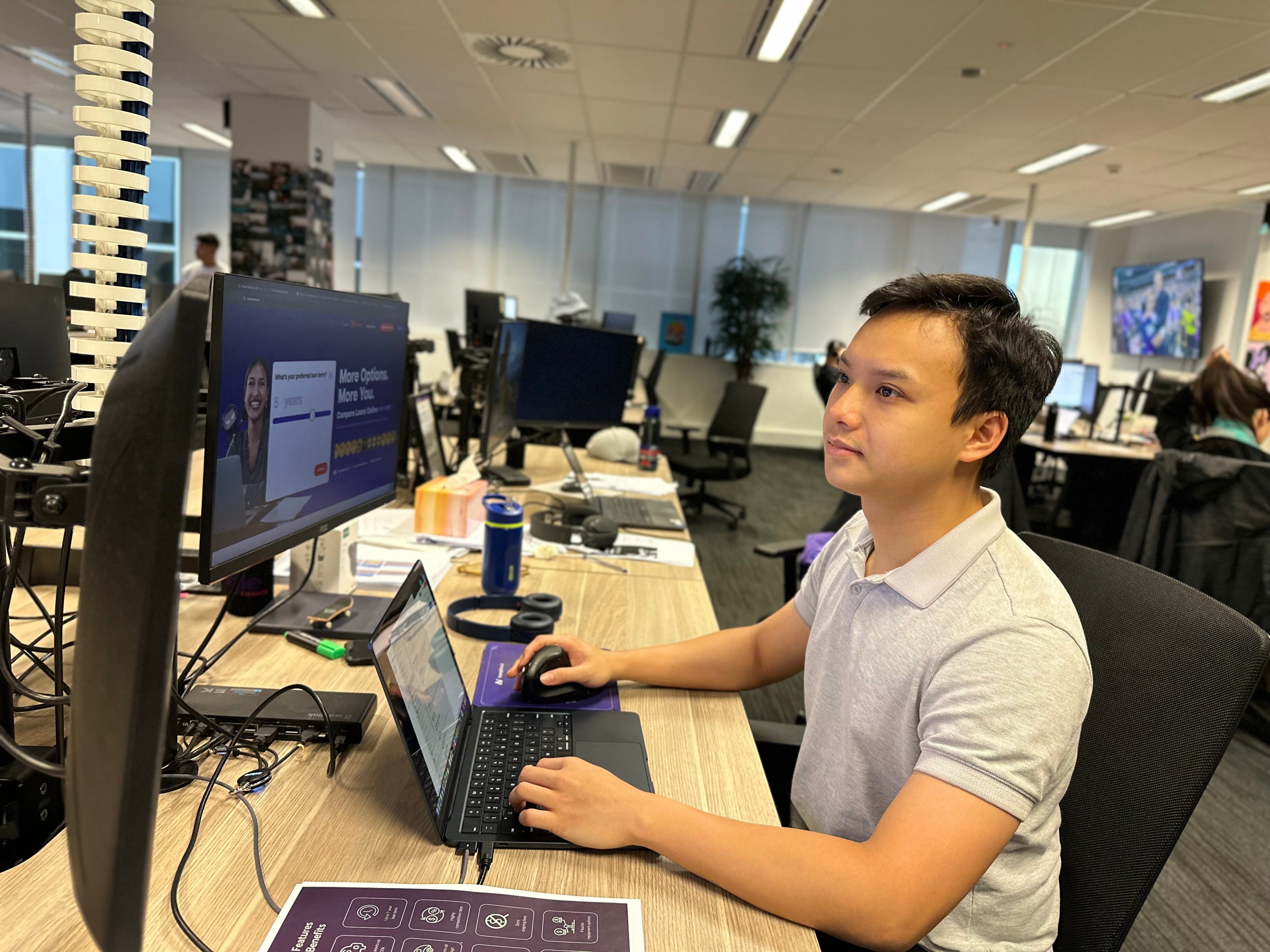 Hung Nguyen at a computer