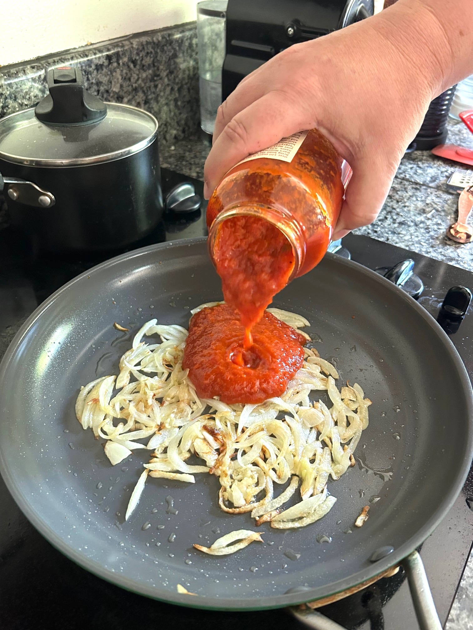 Adding sauce for Ina Garten's Eggs in Purgatory
