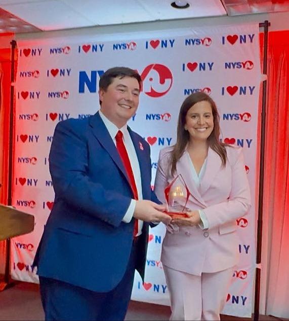 Bobby Walker and Elise Stefanik holding an award.