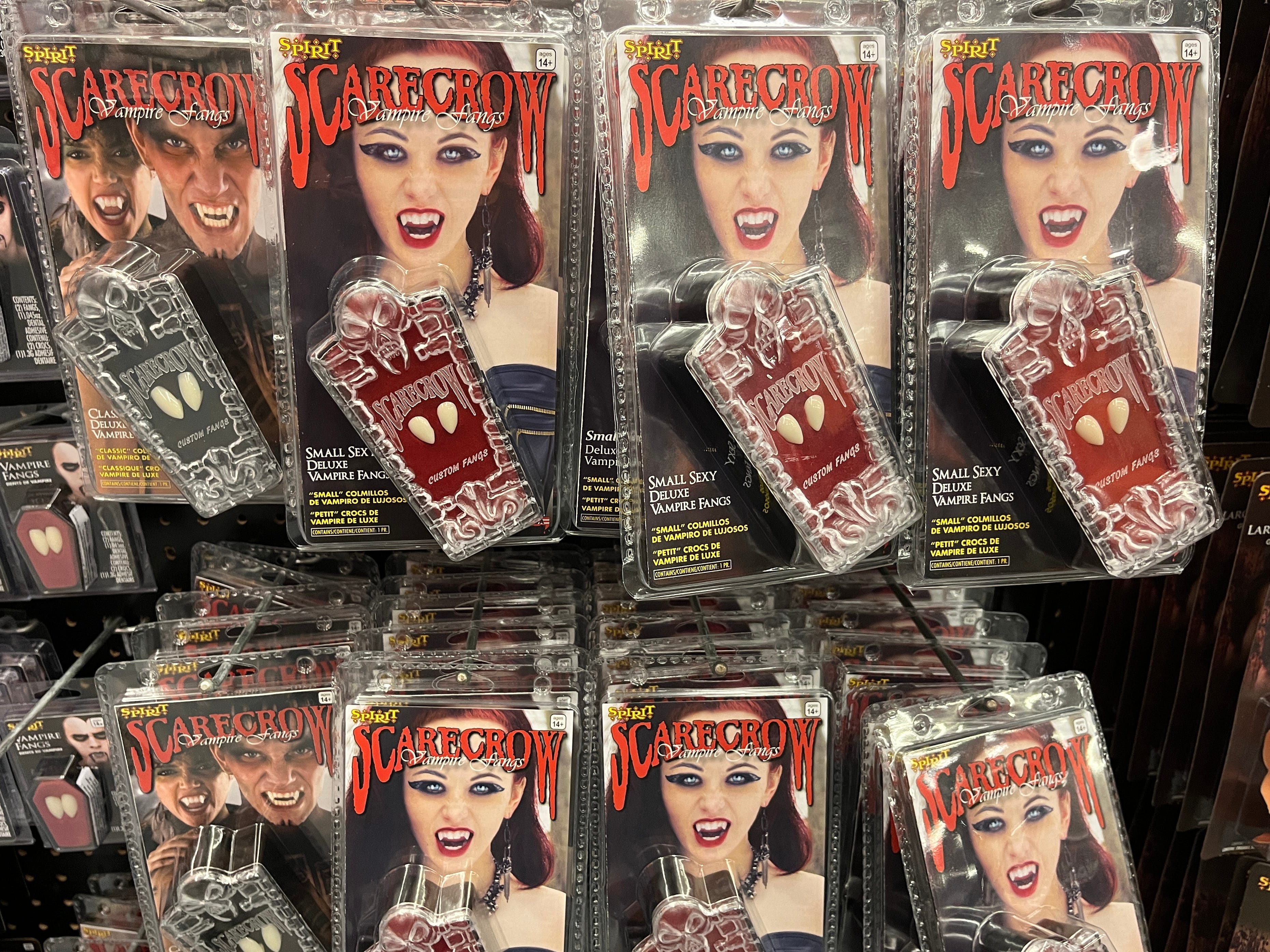 Packages of Scarecrow-brand vampire fangs on display at Spirit Halloween.