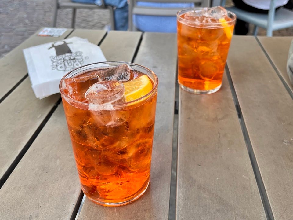 Aperol spritzes on table