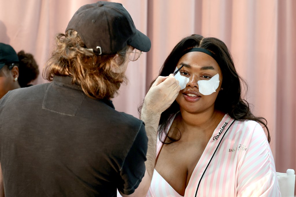 Precious Lee gets glammed up backstage before the Victoria's Secret Fashion Show