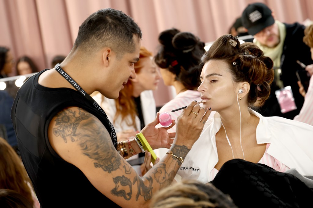 Emily Ratajkowski gets glammed up backstage before the Victoria's Secret Fashion Show