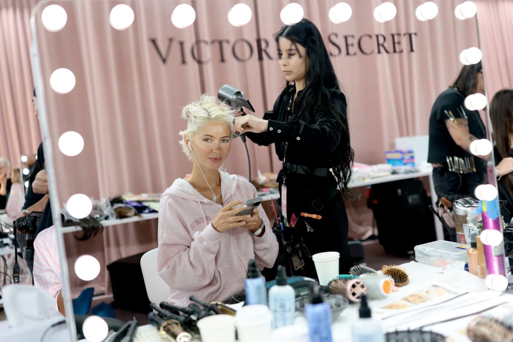 Iris Law gets glammed up backstage before the Victoria's Secret Fashion Show