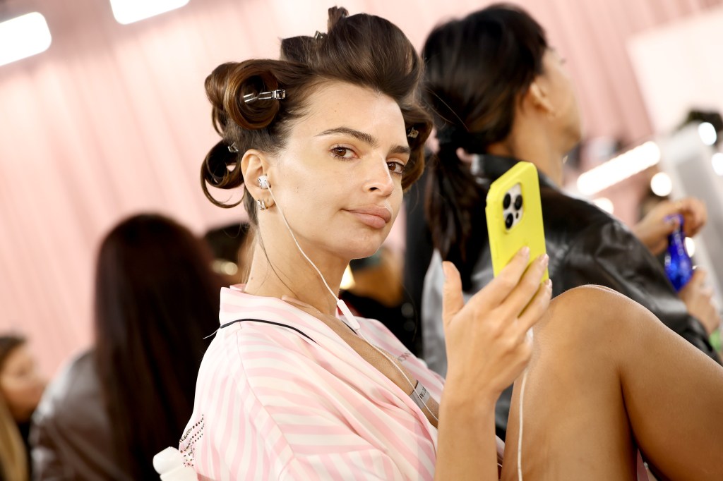 Emily Ratajkowski gets glammed up backstage before the Victoria's Secret Fashion Show
