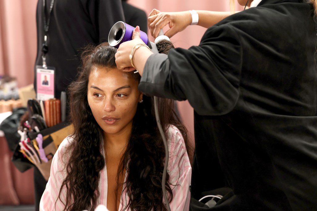 Adriana Lima gets glammed up backstage before the Victoria's Secret Fashion Show