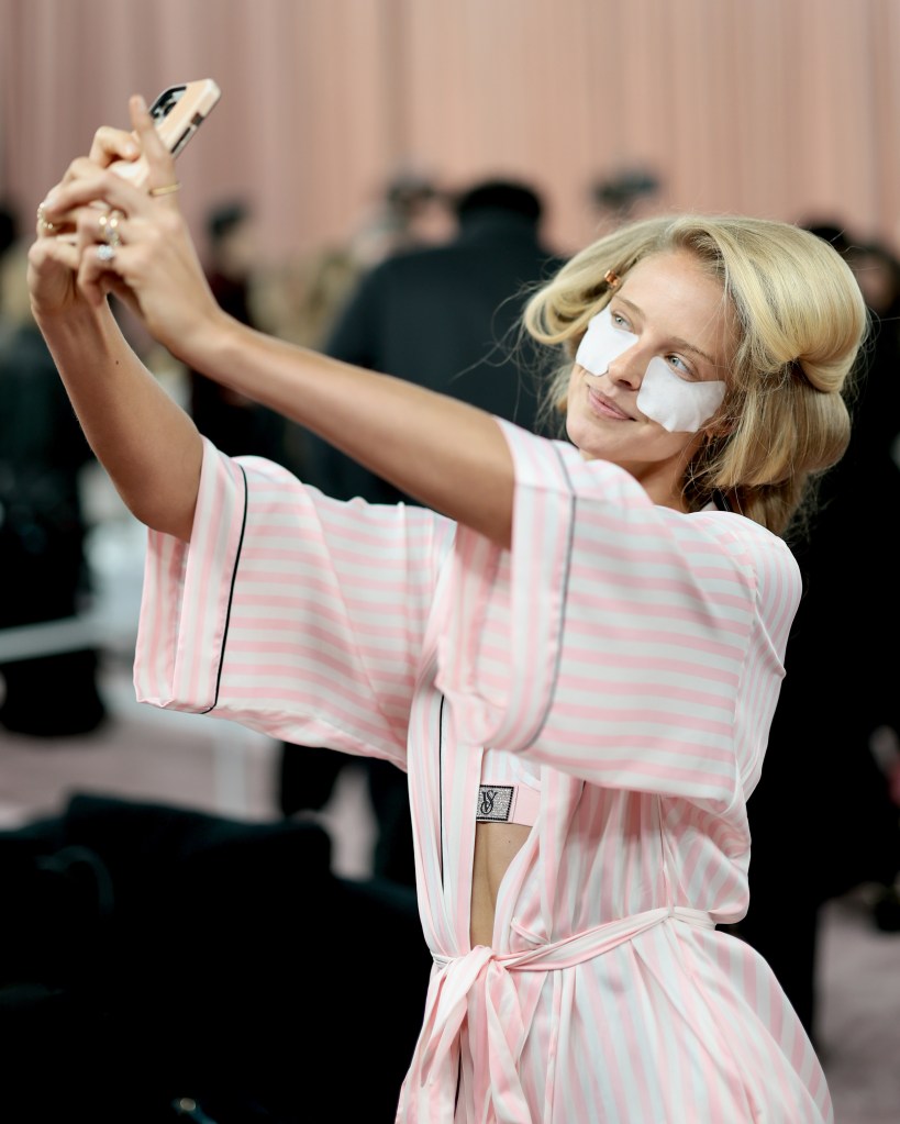 Abby Champion gets glammed up backstage before the Victoria's Secret Fashion Show