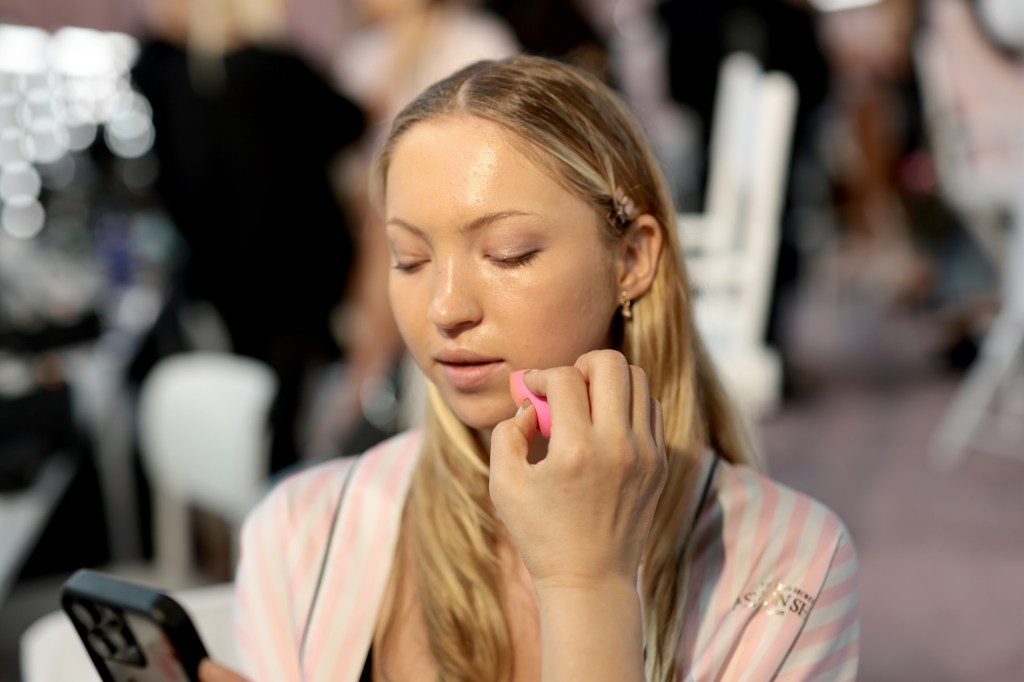 Lila Moss gets glammed up backstage before the Victoria's Secret Fashion Show