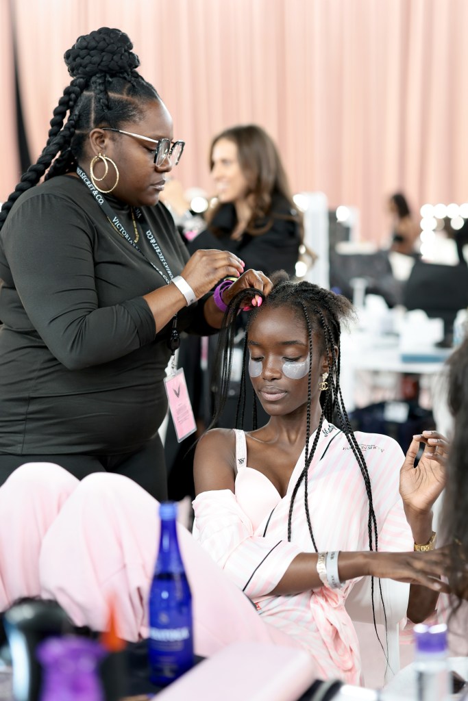 Maty Fall gets glammed up backstage before the Victoria's Secret Fashion Show