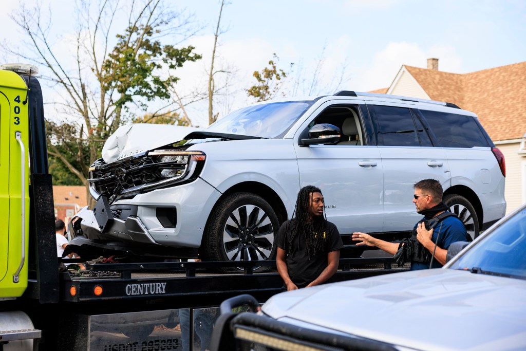 Damaged government vehicle being removed from a protest area in Chicago.