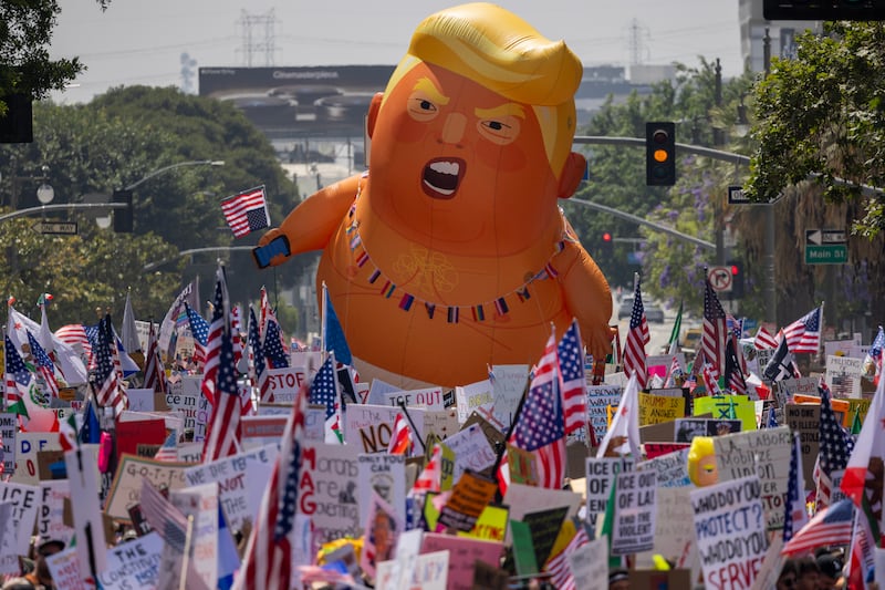 LOS ANGELES, CALIFORNIA - JUNE 14: People march during a