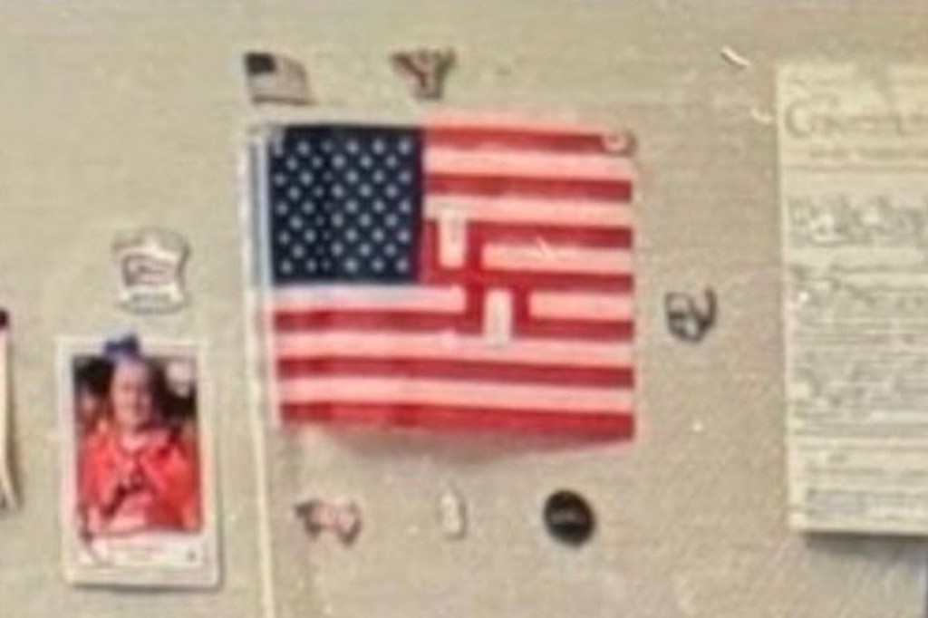 An American flag with a swastika replacing the white stripes.