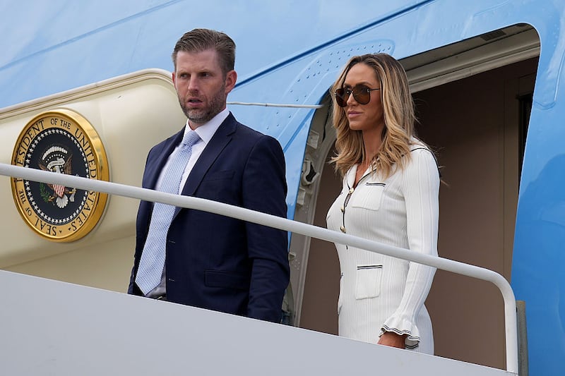 Eric Trump and Lara Trump arrive at RAF Lossiemouth ahead of a helicopter flight to the Trump golf club in Balmedie in Aberdeenshire on July 28, 2025 in Lossiemouth, Scotland.