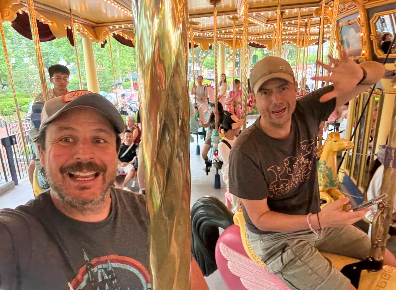 The writer and his best friend on a carousel ride.