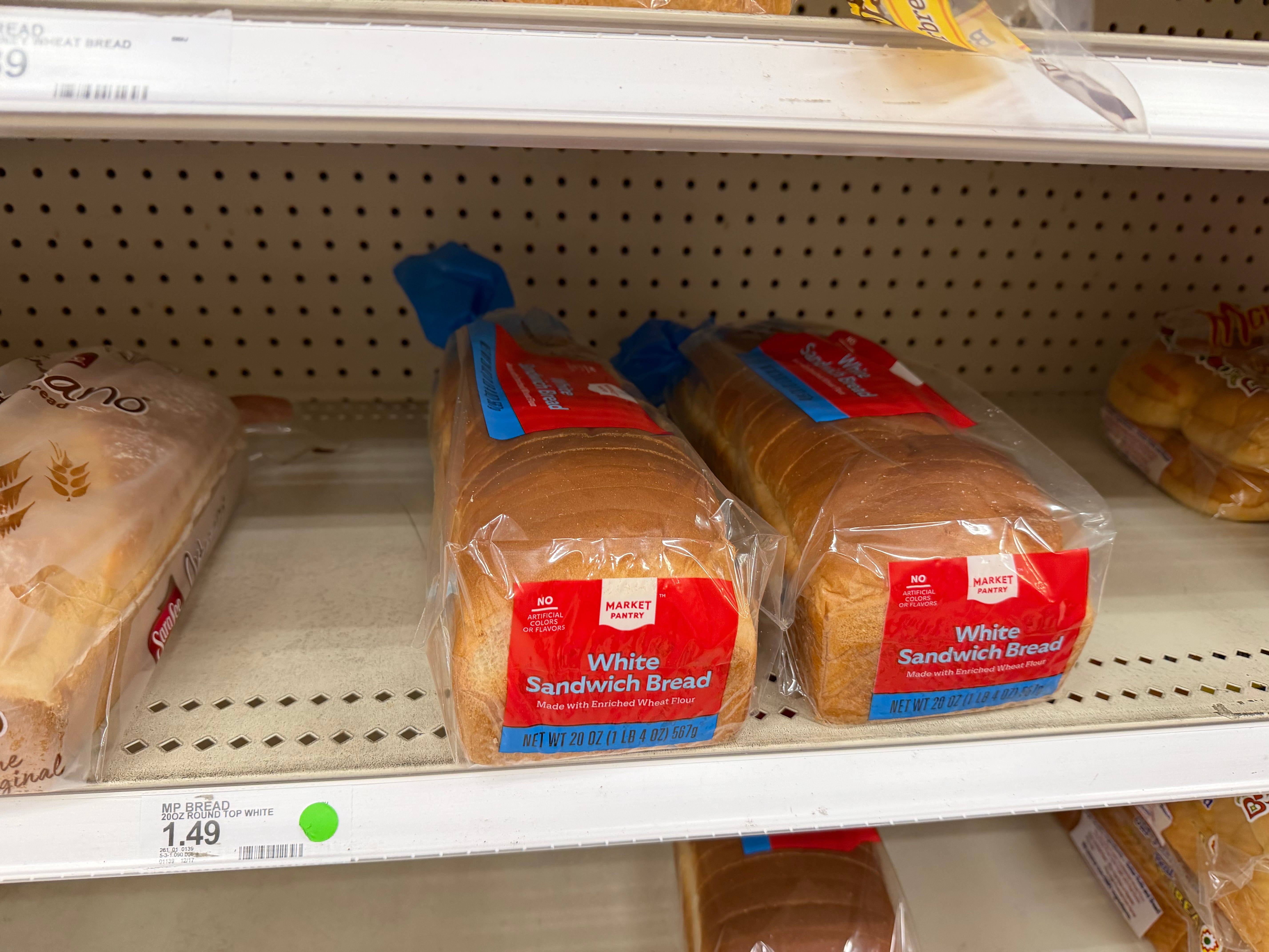 Two loaves of bread on shelf at Ta
