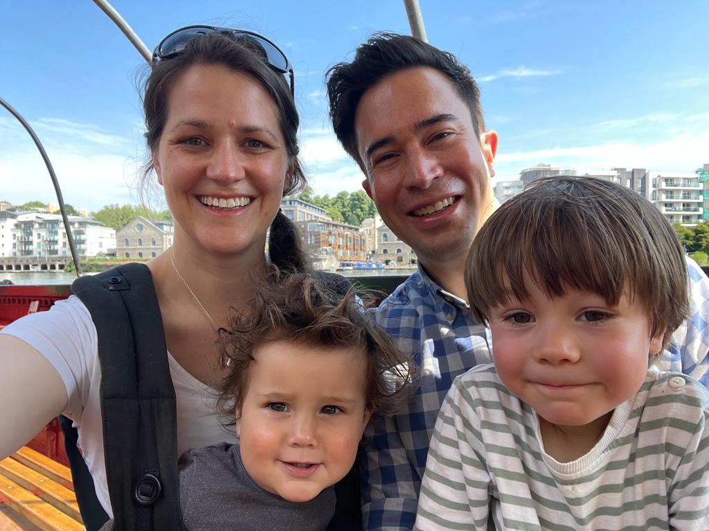 The author posing for a selfie with his wife and their two children.