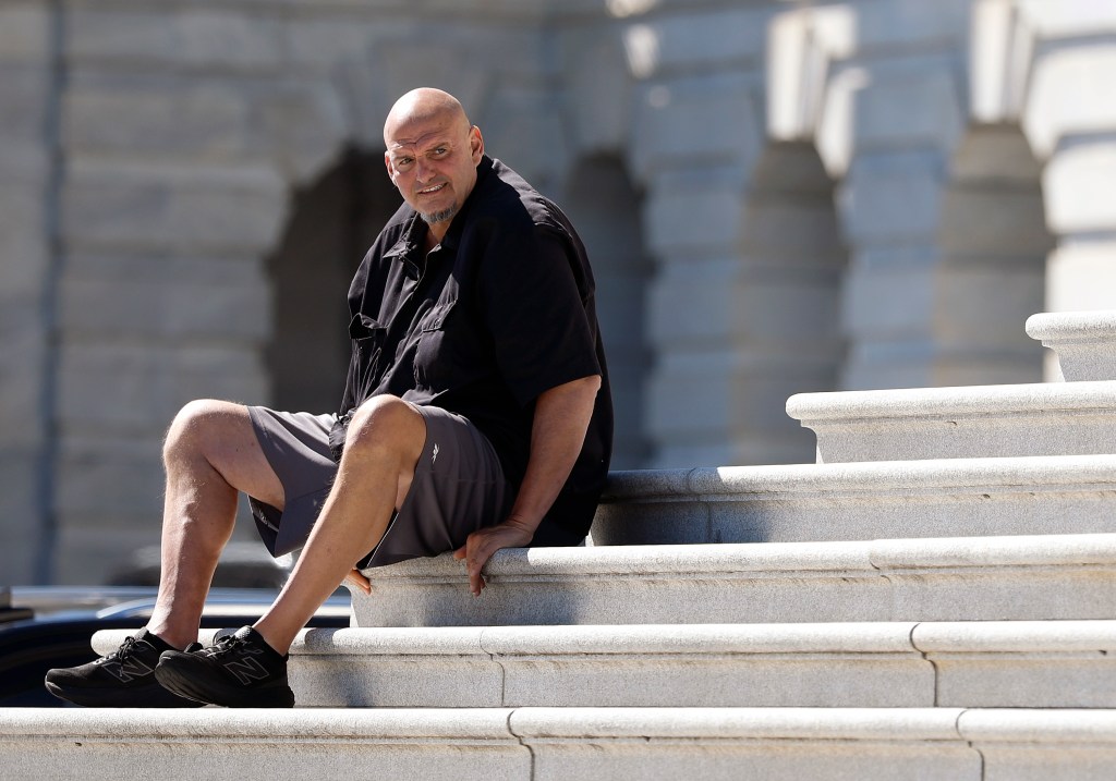 U.S. Sen. John Fetterman (D-PA) sits on the steps of the U.S. Capitol.