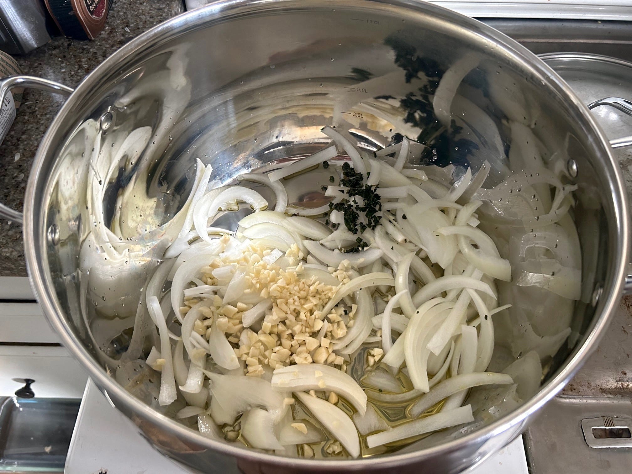 Cooking veggies and herbs for Pioneer Woman's Lasagna Soup