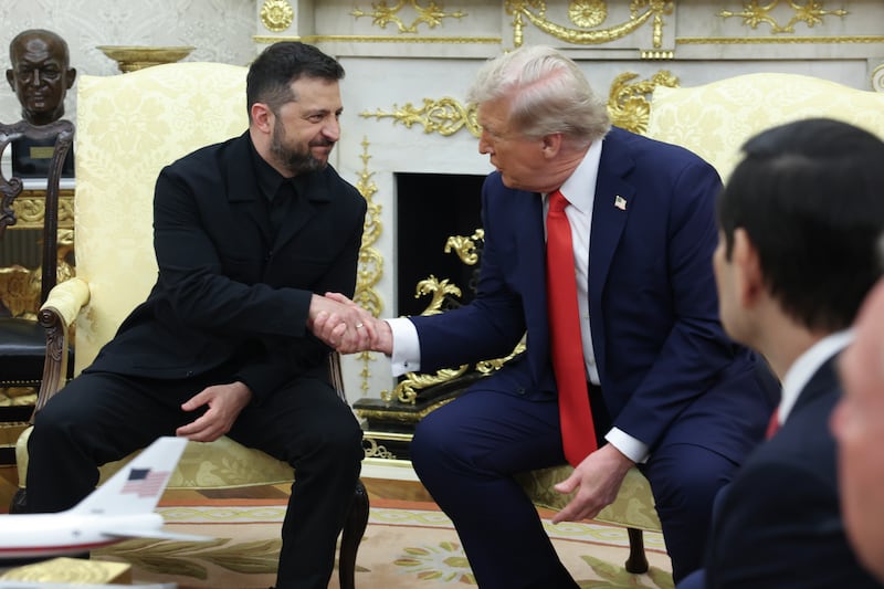 U.S. President Donald Trump shakes hands with Ukrainian President Volodymyr Zelensky during a meeting in the Oval Office
