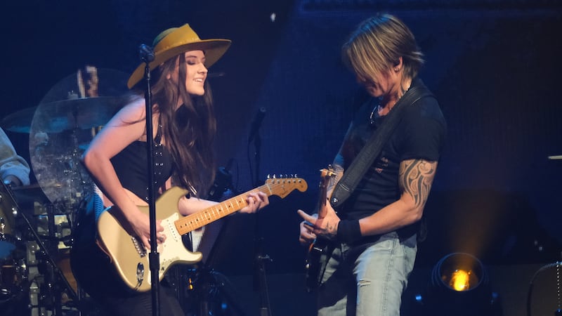 AUSTIN, TEXAS - MAY 04: (L-R) Maggie Baugh and Keith Urban perform onstage at the 2024 iHeartCountry Festival - Show at Moody Center on May 04, 2024 in Austin, Texas.