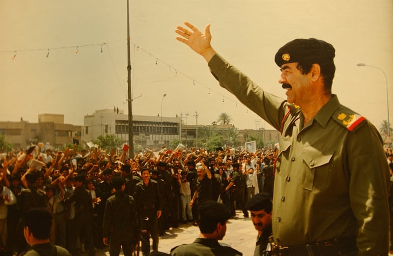 At the "Triumph Leader Museum," which glorifies the life of Iraqi leader Saddam Hussein,  a photo showing Saddam Hussein greeting his people is displayed.