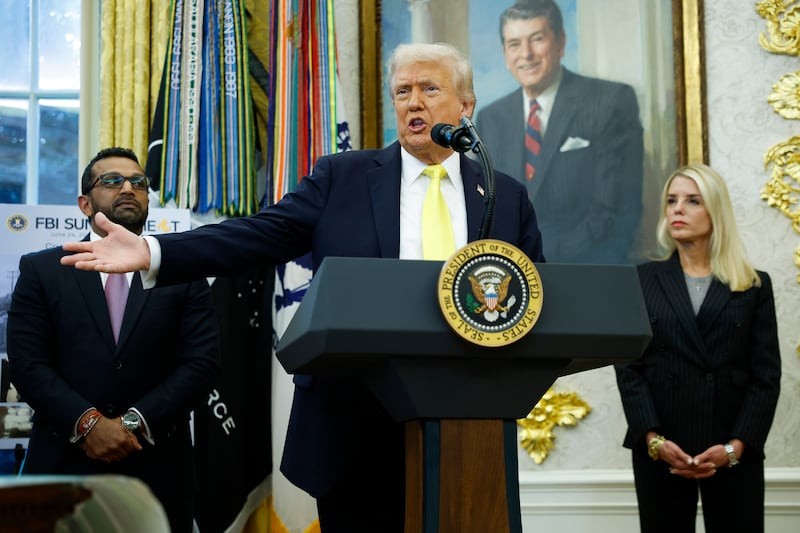 Donald Trump speaks as Federal Bureau of Investigation Director Kash Patel (L) and U.S. Attorney General Pam Bondi look on during a press conference in the Oval Office of the White House on October 15, 2025 in Washington, DC.