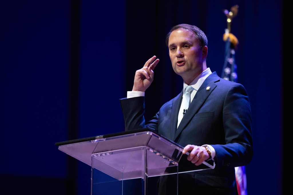 Jason Miyares speaking at a debate.