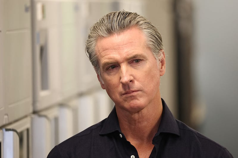 California Governor Gavin Newsom listens before speaking during a press conference announcing $11 insulin and prescription drugs with the CalRX program inside a Cedars-Sinai pharmacy in Los Angeles, California on October 16, 2025.
