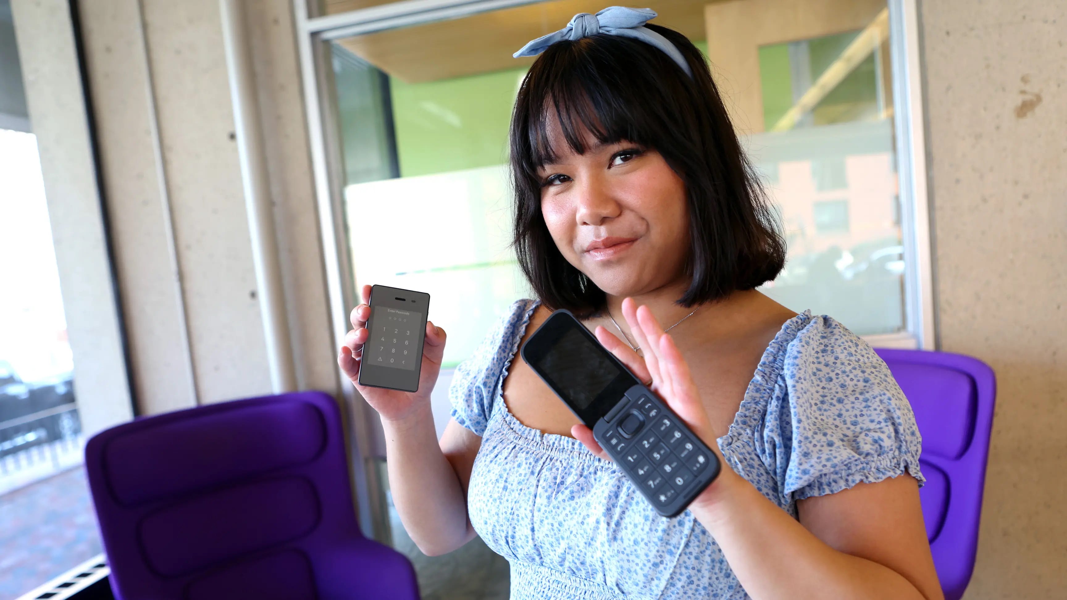 Gabriela Nguyen holding a Light Phone and Cat S22 phone