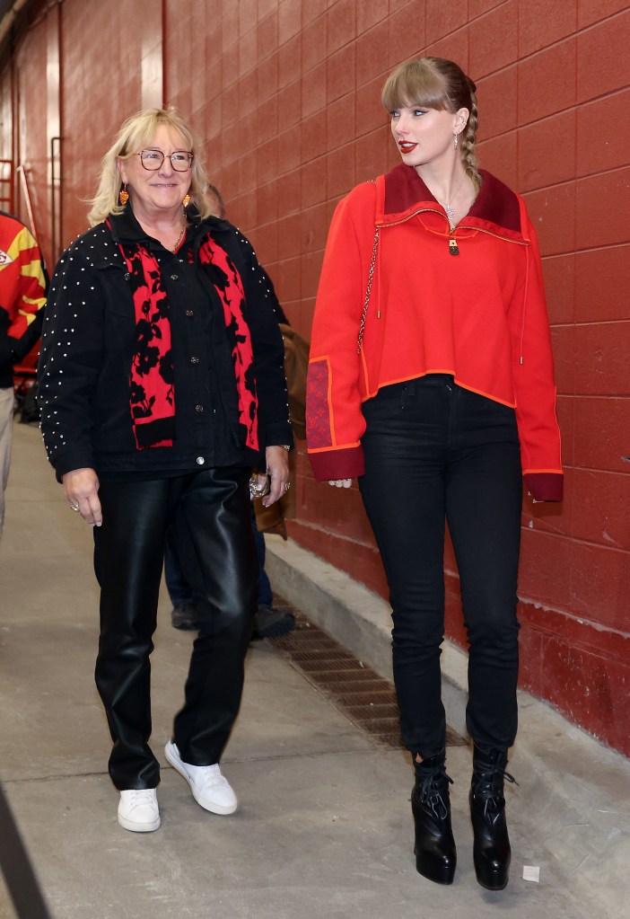 Singer Taylor Swift walks into the stadium alongside Donna Kelce.