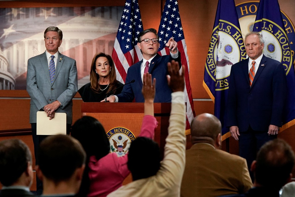 U.S. House Speaker Mike Johnson and other congressional representatives at a press conference during a government shutdown.