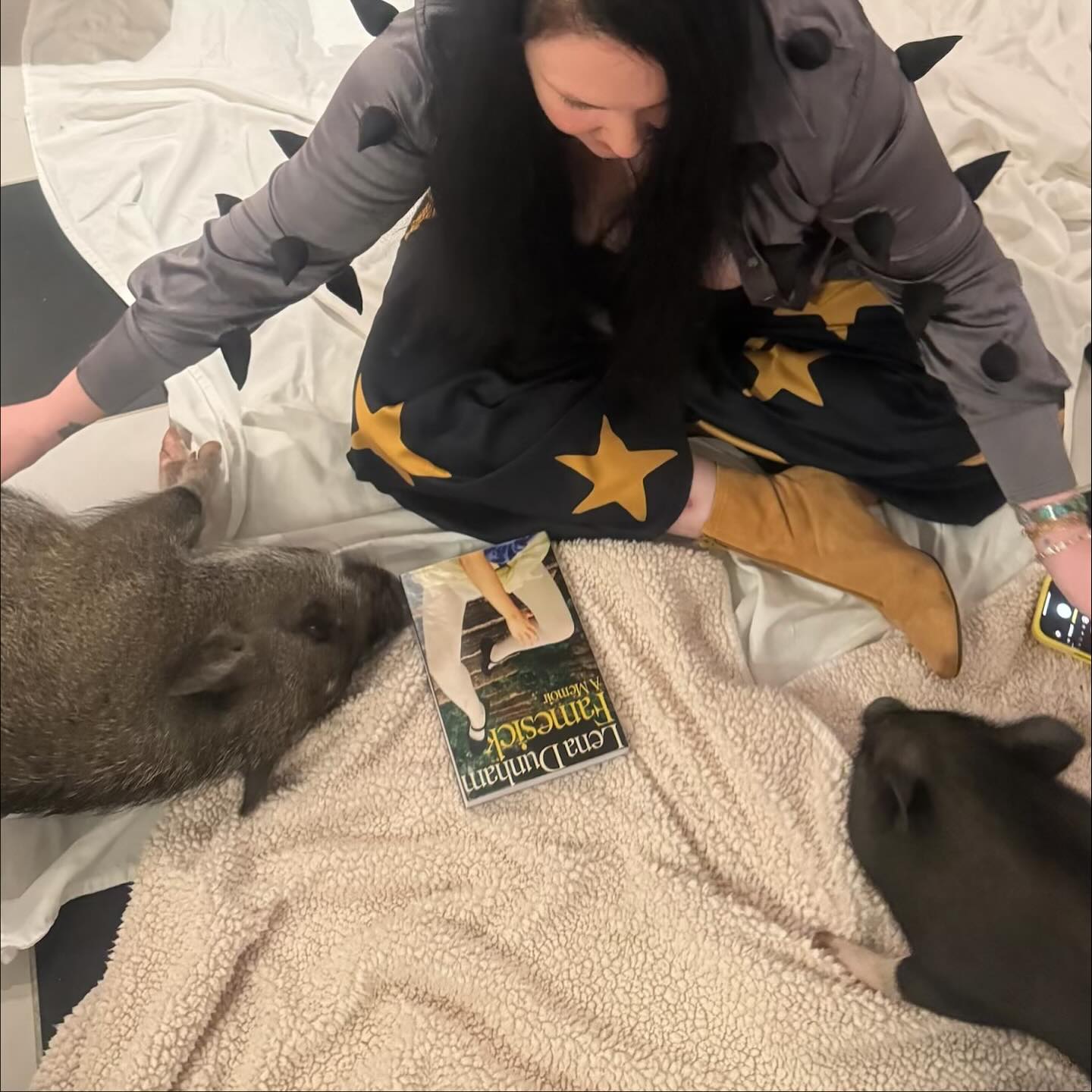 Lena Dunham hangs out with her pigs.