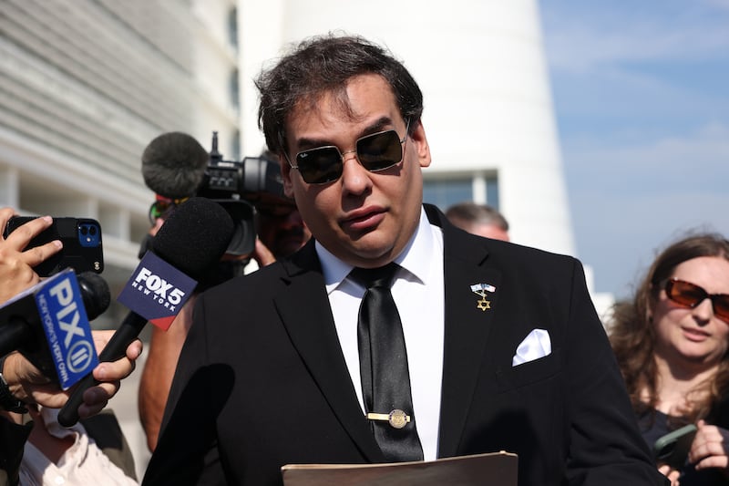 WEST ISLIP, NEW YORK - AUGUST 19: Former U.S. Rep. George Santos gives a statement after a court hearing on August 19, 2024 in West Islip, New York. Santos pleaded guilty to wire fraud and aggravated identity theft weeks before his federal trial was set to begin. His sentencing has been scheduled for February 7, and he faces more than six years in prison under federal sentencing guidelines. Santos owes at least $370,000 in restitution. He was expelled from Congress in 2023, becoming the sixth member in the chamber’s history to be ousted by colleagues. (Photo by Michael M. Santiago/Getty Images)