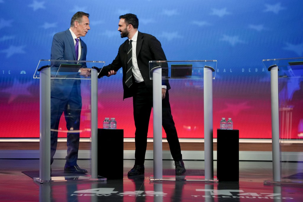Independent nominee, former New York Gov. Andrew Cuomo (L) greets Democratic nominee Zohran Mamdani before participating in a mayoral debate at Rockefeller Center on October 16,