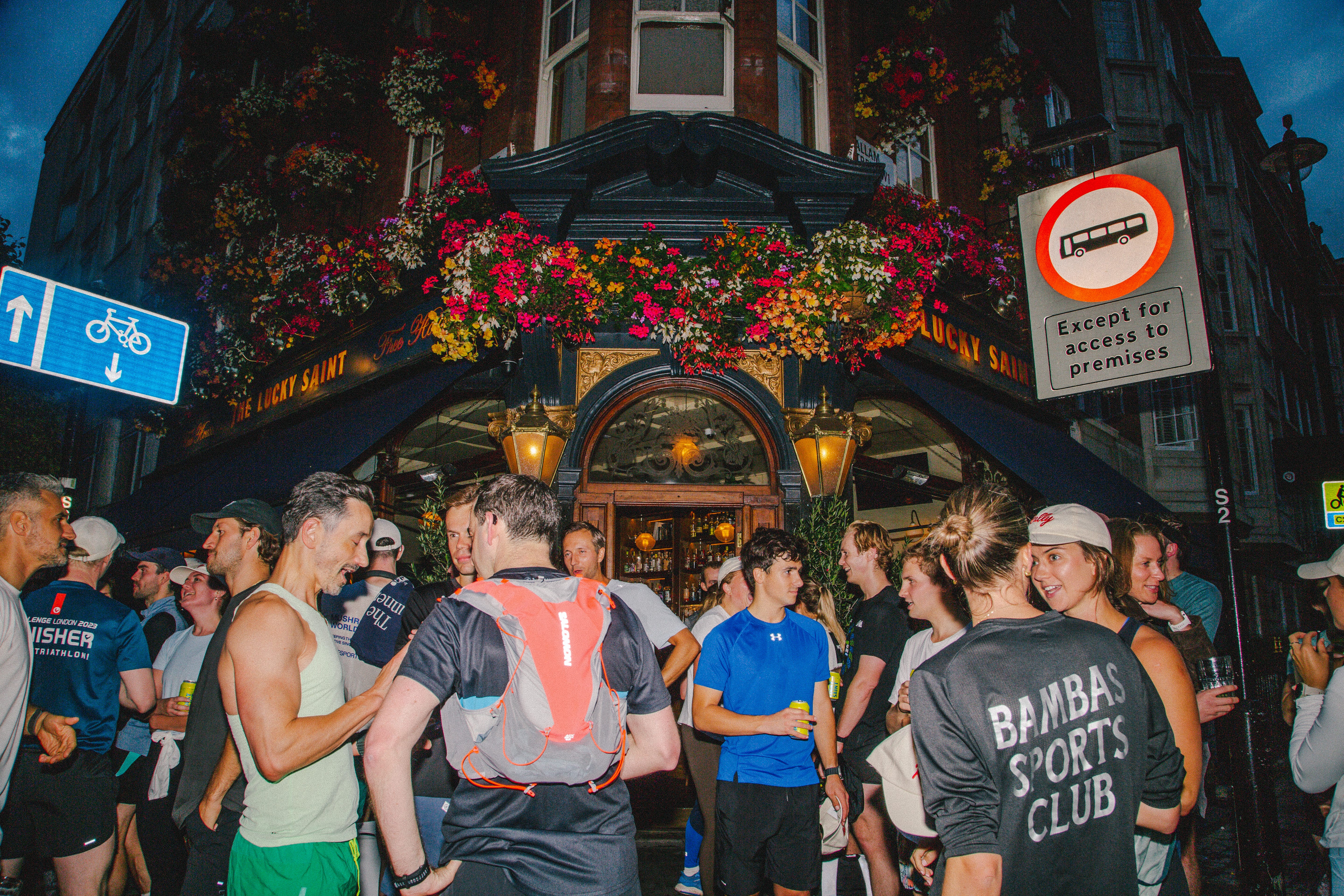 People talking outside a pub.
